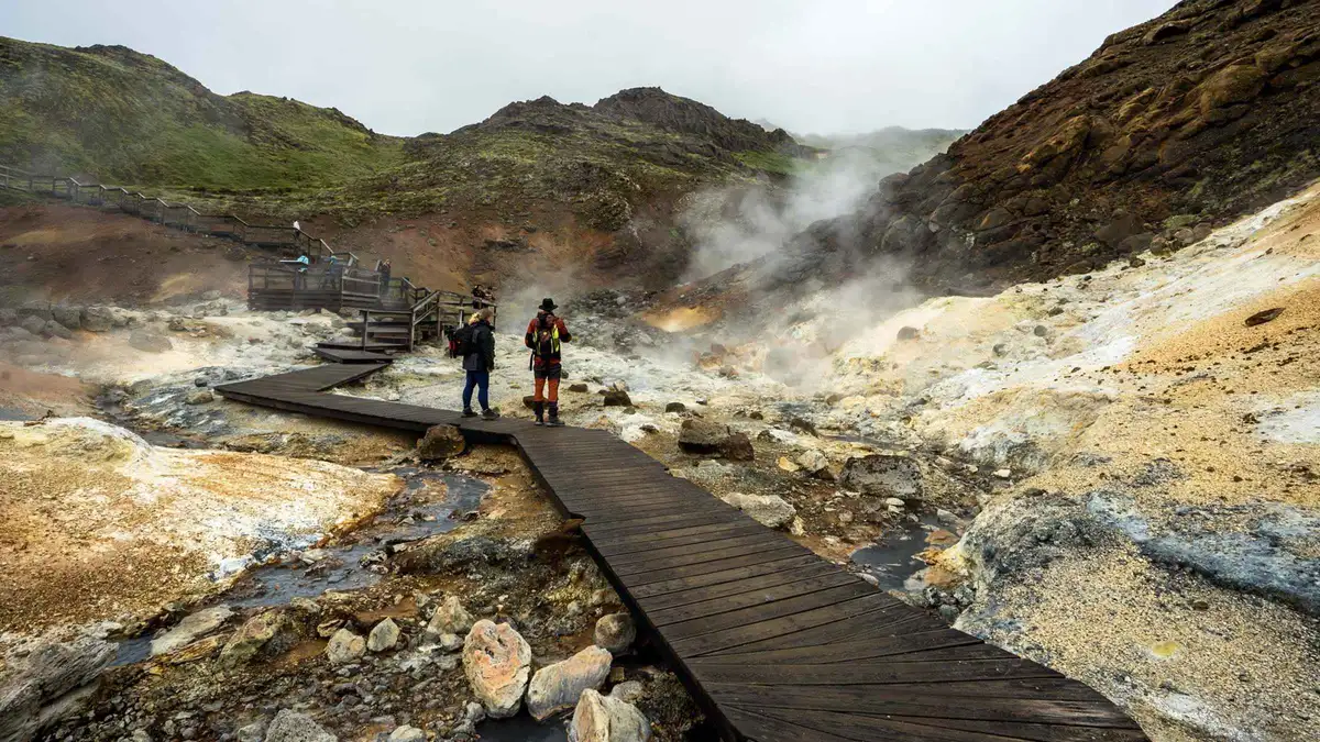 Steaming geothermal hot springs and colorful mineral terrain on a Fagradalsfjall volcano tour of the Reykjanes Peninsula