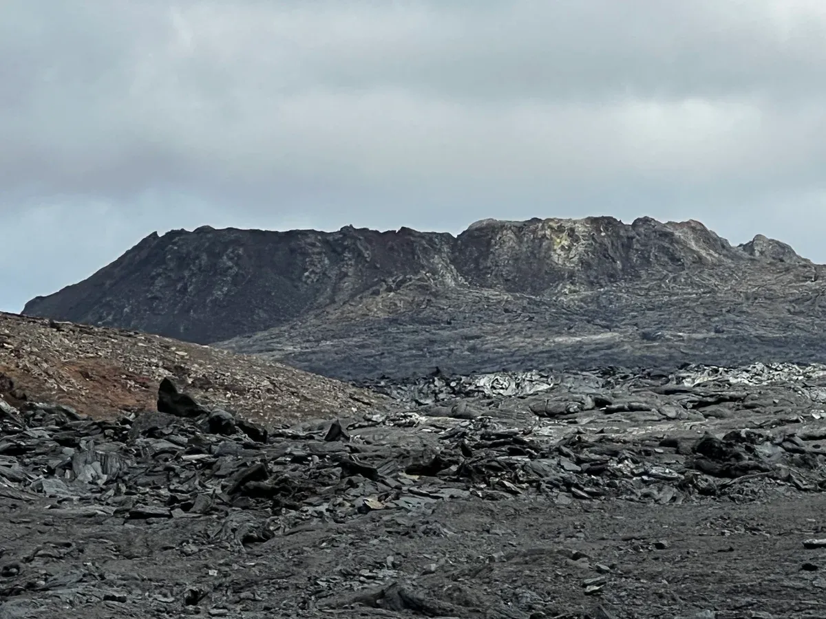 The cooled Geldingadalir crater that a Fagradalsfjall volcano tour hike reaches, Reykjanes, Iceland