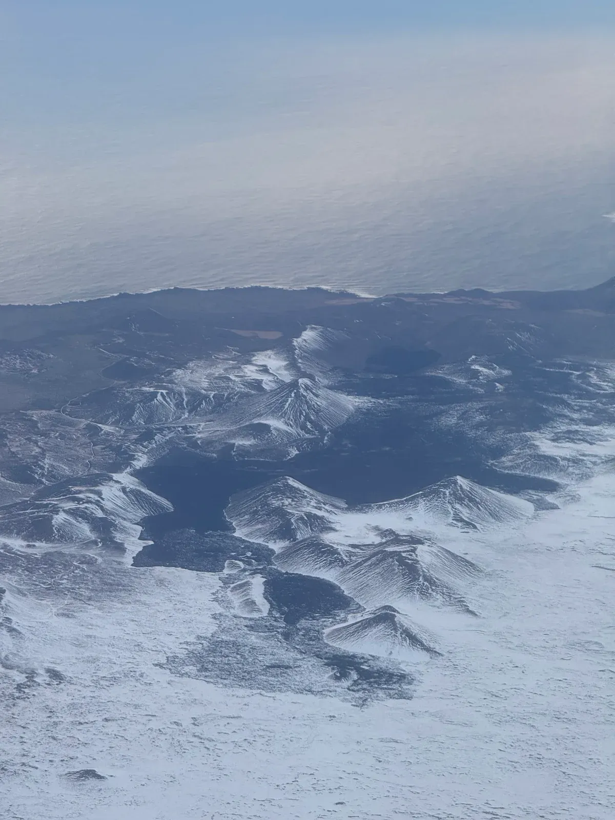 Aerial view of the cooled Reykjanes lava fields as seen on a Fagradalsfjall volcano helicopter tour, Iceland